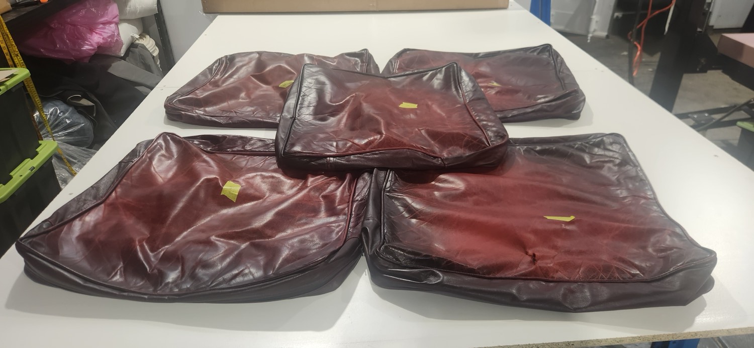 Worn thirty year old Moran Chesterfield seat cushions before remaking
